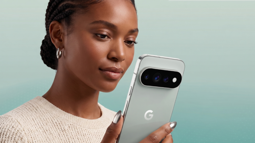 A person holding the new Google Pixel 11 Pro featuring a sleek metallic finish and coral back panel